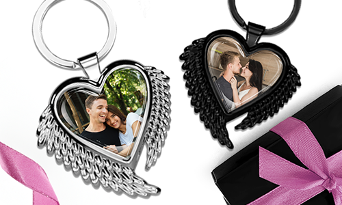 Heart-shaped keychain with wings and photo of couple