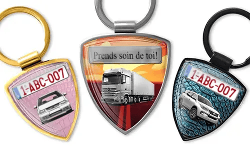 Shield-shaped photo keychain with car and truck designs