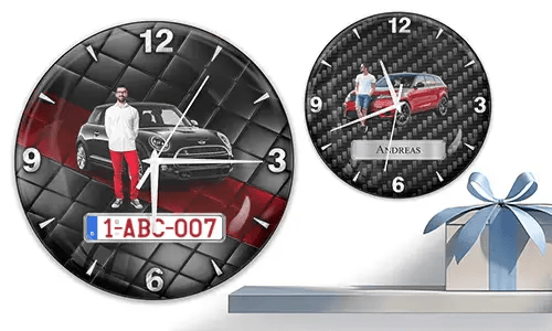 Two wall clocks with male figures and cars: left with black car on quilted background, right with red car and carbon texture