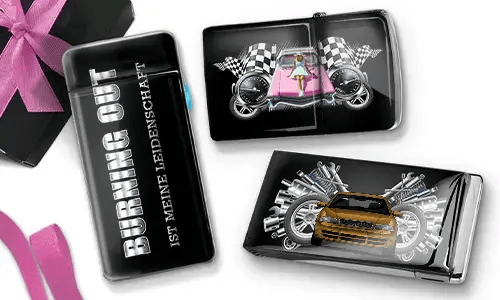 A decorative lighter and two cases featuring racing themes. One lighter reads 