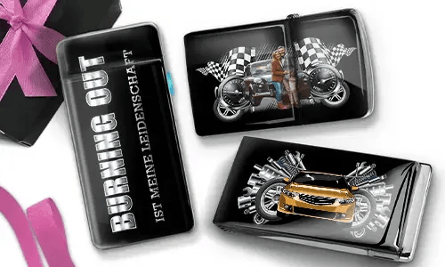 Three glossy cigarette cases with automotive themes. One reads 