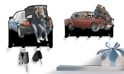 Two personalized key holders: couple in blue-black car trunk, couple on red vintage car hood